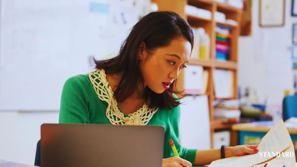 Classroom Teacher Working at Desk